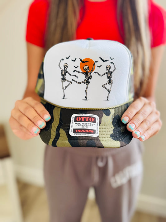 Halloween inspired camo trucker hat with skeleton print